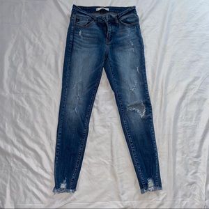 Distressed medium rise jeans